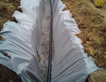 Subsoil drain with geotextile